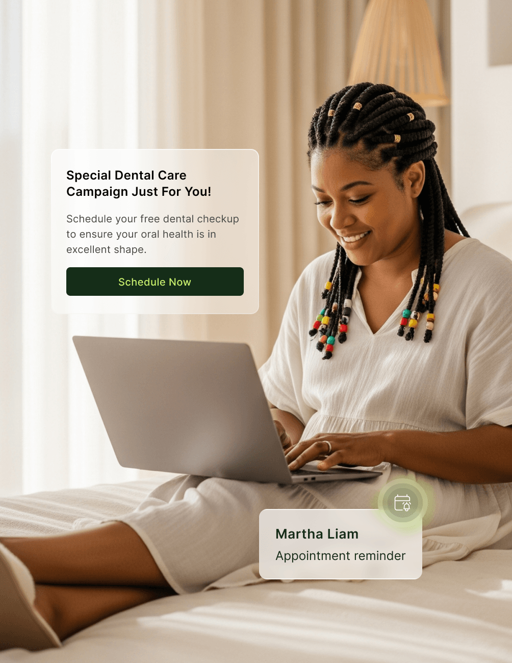 Woman with braided hair using a laptop on a bed, with a dental care campaign and appointment reminder on screen.