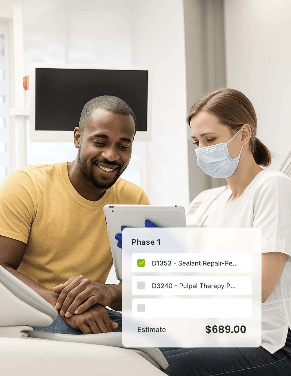 A dentist shows a male patient a tablet screen with dental procedure details. An estimate of $689.00 is displayed.