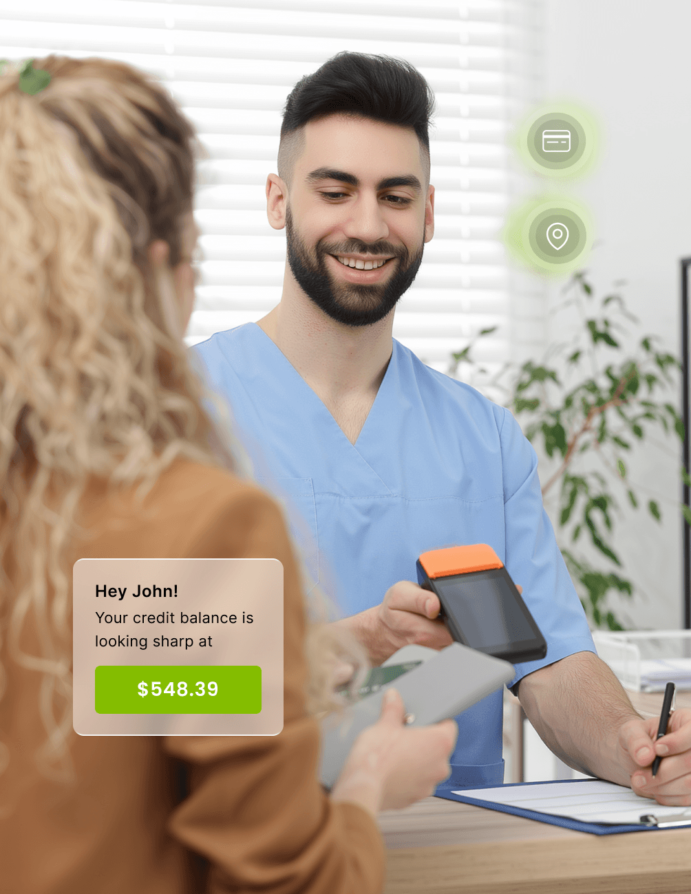 Man in blue scrubs smiling, holding a card reader. A notification shows a credit balance of $548.39. Woman in foreground holding a card.
