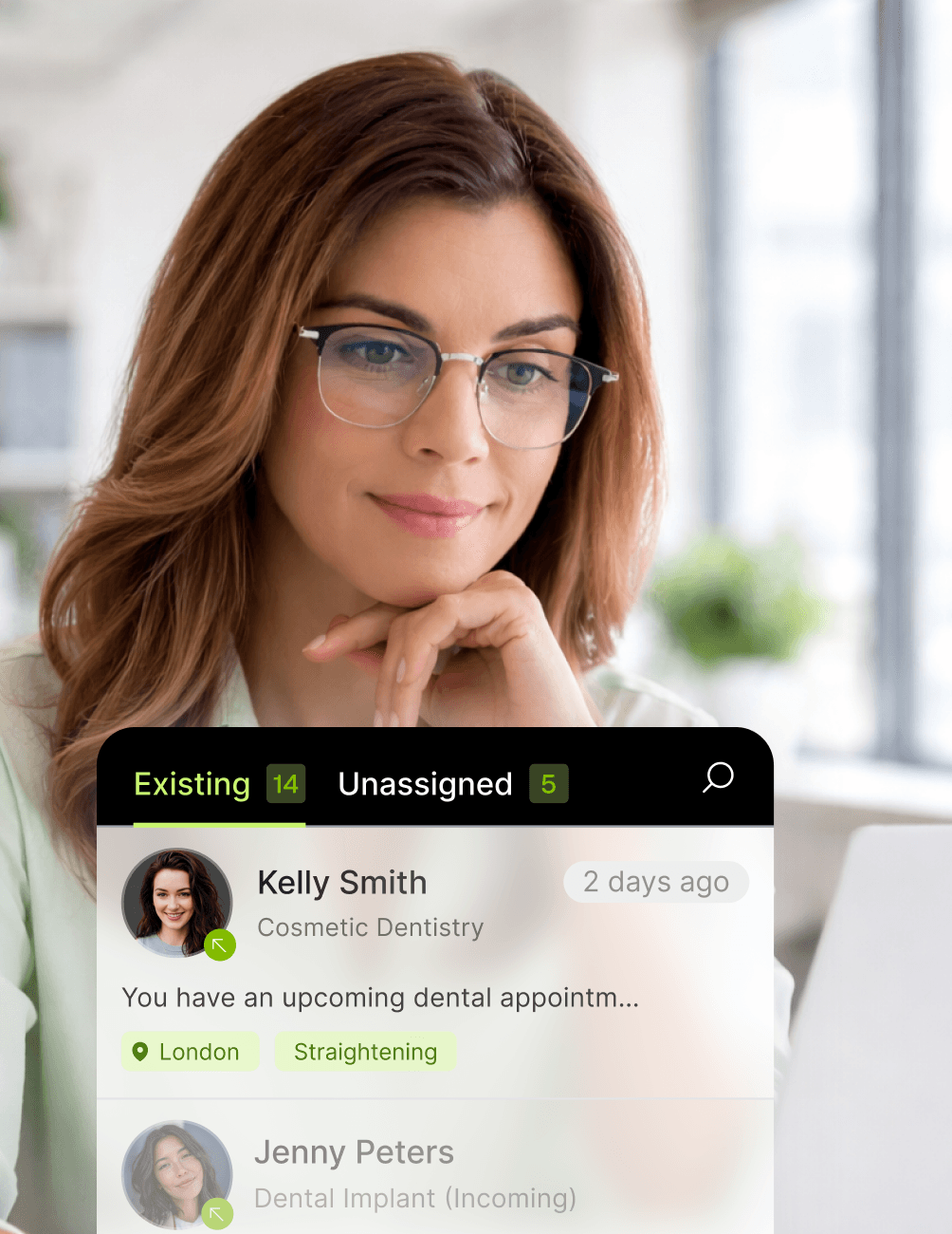 Woman with glasses using a dental appointment management app, viewing patient details and statuses on-screen.