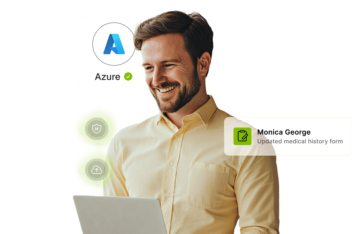 Smiling man using a laptop, with Azure logo and notification about Monica George's updated medical history form. Green icons are displayed.