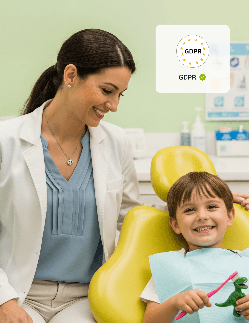 Customisable Solutions for Paediatric Practices A smiling dentist with a young boy holding a toy in a dental chair. A GDPR compliance icon displayed in the top right corner.